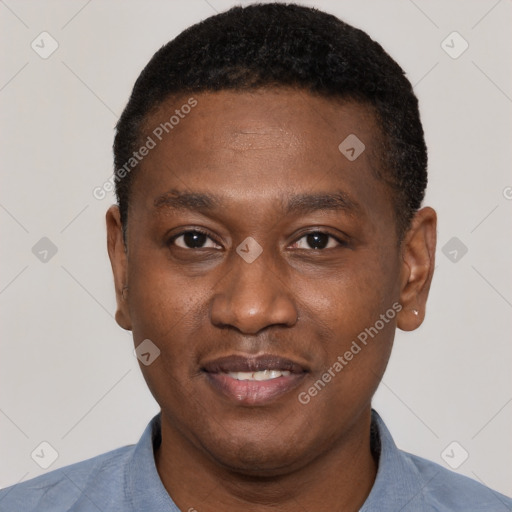 Joyful black young-adult male with short  black hair and brown eyes