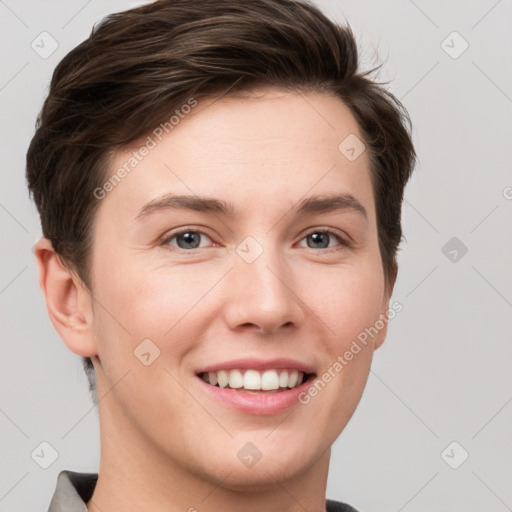 Joyful white young-adult female with short  brown hair and grey eyes