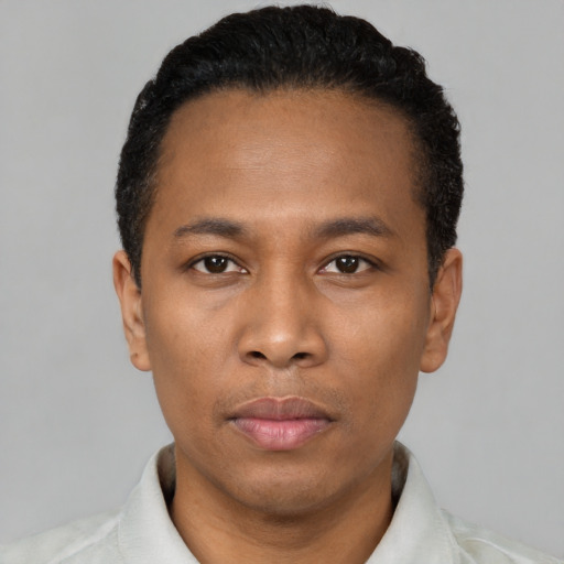 Neutral black adult male with short  black hair and brown eyes