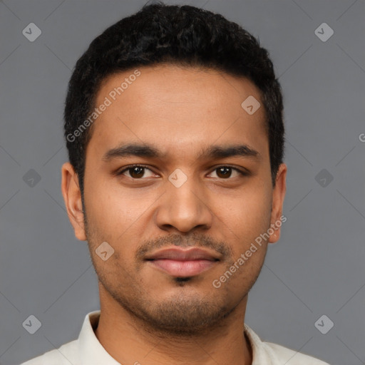 Joyful latino young-adult male with short  brown hair and brown eyes