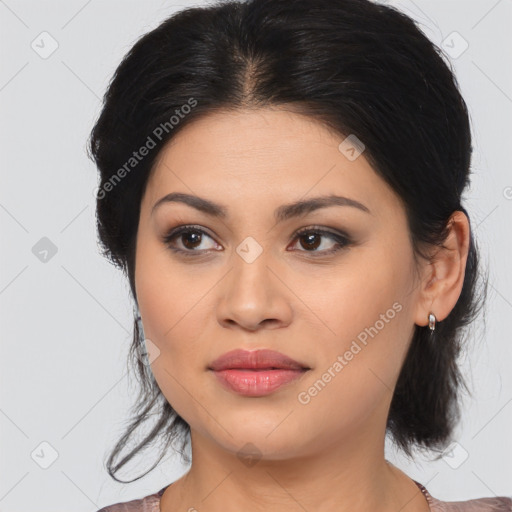 Joyful latino young-adult female with medium  brown hair and brown eyes