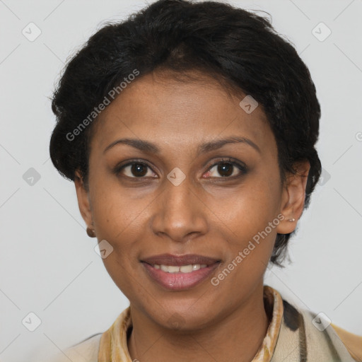 Joyful black adult female with short  brown hair and brown eyes