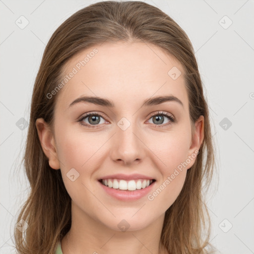 Joyful white young-adult female with long  brown hair and grey eyes