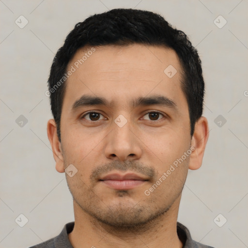 Neutral latino young-adult male with short  black hair and brown eyes