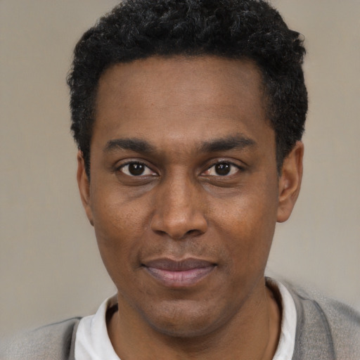 Neutral black young-adult male with short  black hair and brown eyes