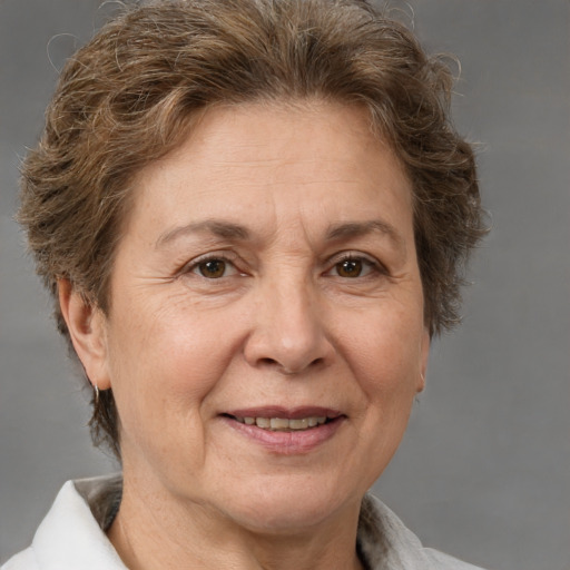 Joyful white middle-aged female with short  brown hair and brown eyes