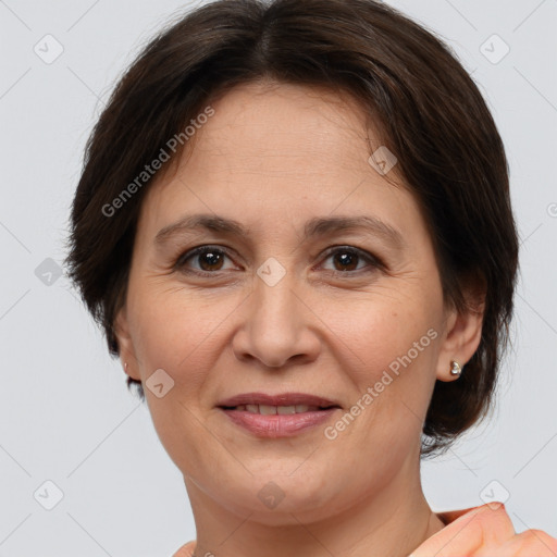 Joyful white adult female with medium  brown hair and brown eyes