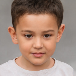 Joyful white child male with short  brown hair and brown eyes