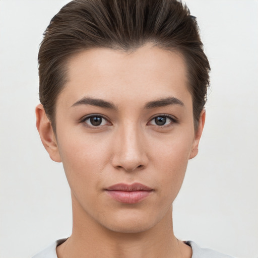 Neutral white young-adult female with short  brown hair and brown eyes