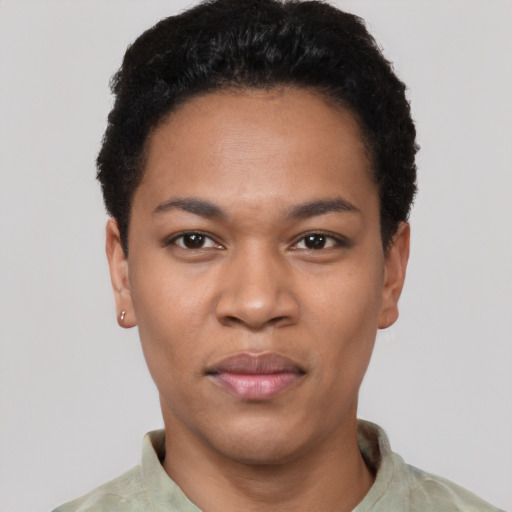 Joyful latino young-adult female with short  black hair and brown eyes