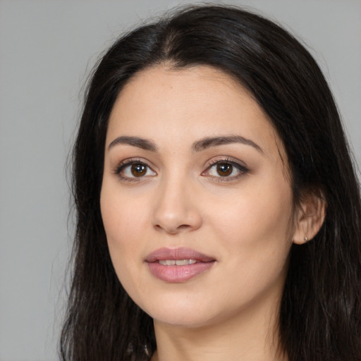 Joyful white young-adult female with long  black hair and brown eyes