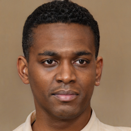 Neutral black young-adult male with short  black hair and brown eyes