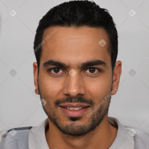 Joyful latino young-adult male with short  black hair and brown eyes