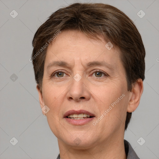 Joyful white adult female with short  brown hair and grey eyes