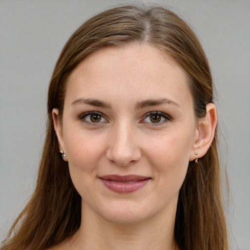 Joyful white young-adult female with long  brown hair and grey eyes