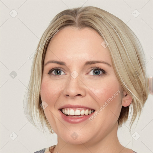 Joyful white adult female with medium  brown hair and blue eyes