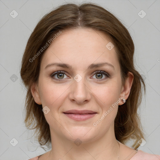 Joyful white young-adult female with medium  brown hair and green eyes