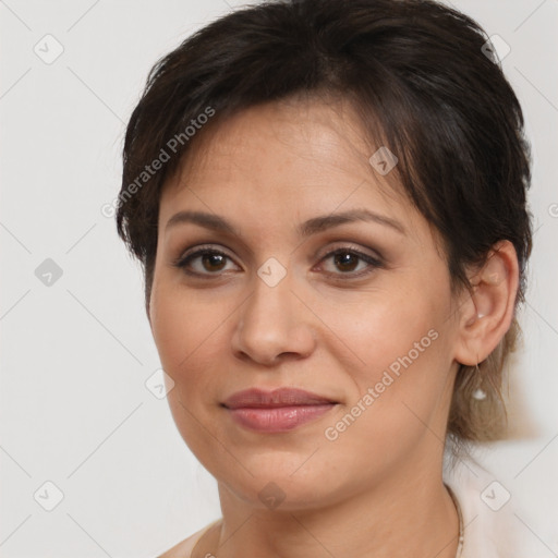 Joyful white adult female with medium  brown hair and brown eyes