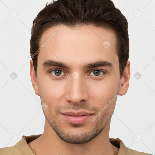 Joyful white young-adult male with short  brown hair and brown eyes