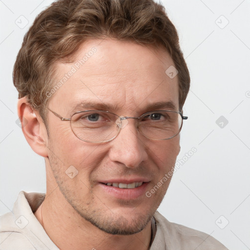 Joyful white adult male with short  brown hair and grey eyes