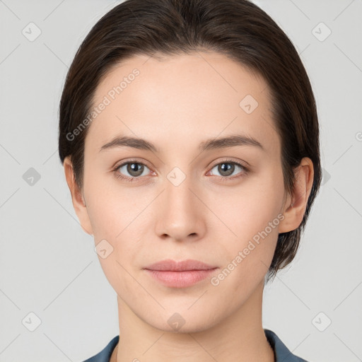 Neutral white young-adult female with short  brown hair and brown eyes