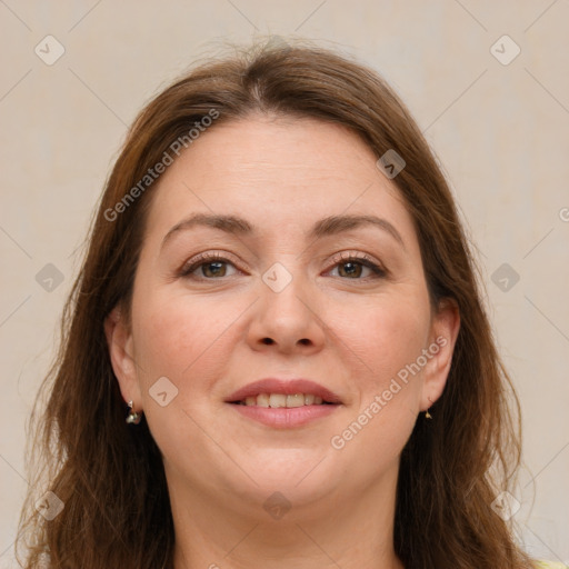 Joyful white adult female with long  brown hair and brown eyes