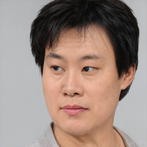 Neutral asian young-adult male with short  brown hair and brown eyes