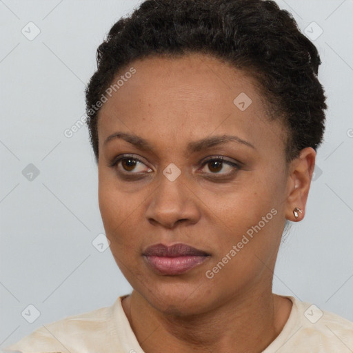 Neutral black young-adult female with short  brown hair and brown eyes