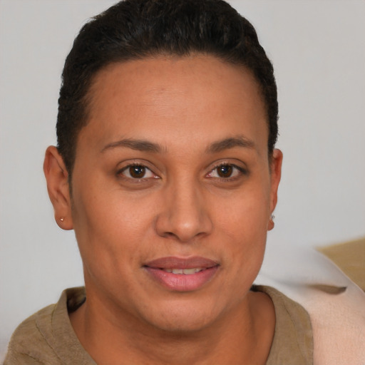 Joyful latino young-adult female with short  brown hair and brown eyes