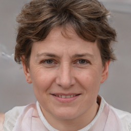 Joyful white adult female with short  brown hair and brown eyes