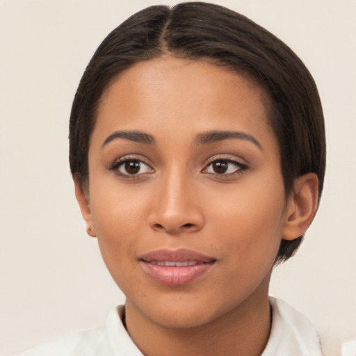 Joyful latino young-adult female with short  brown hair and brown eyes