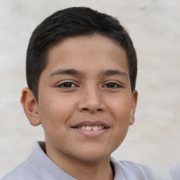 Joyful latino child male with short  brown hair and brown eyes