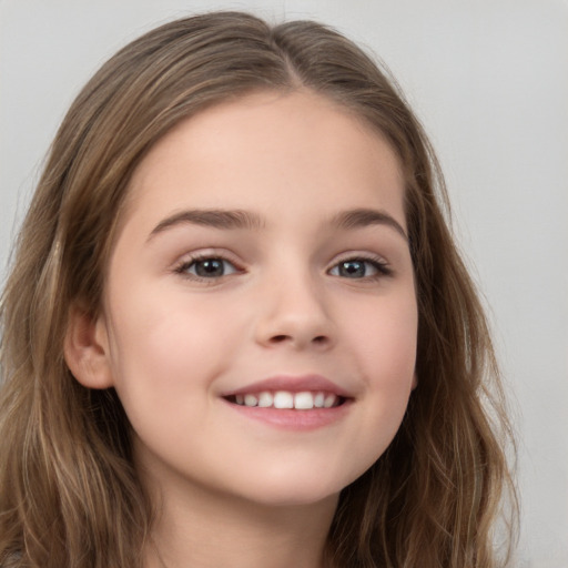 Joyful white child female with long  brown hair and brown eyes