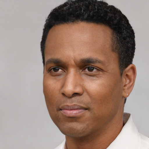 Neutral latino adult male with short  black hair and brown eyes