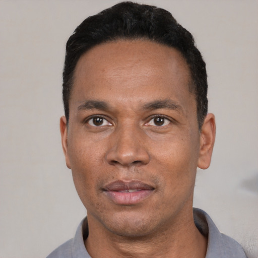 Neutral black adult male with short  black hair and brown eyes