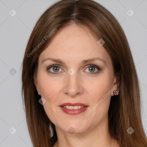 Joyful white adult female with long  brown hair and grey eyes