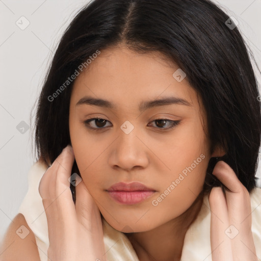 Joyful latino young-adult female with long  brown hair and brown eyes