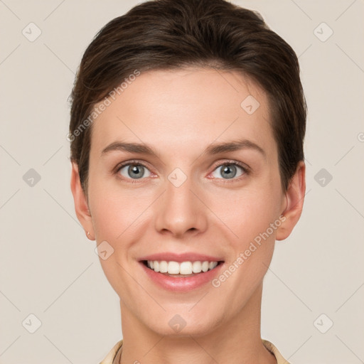 Joyful white young-adult female with short  brown hair and grey eyes