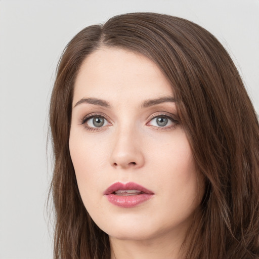 Neutral white young-adult female with long  brown hair and green eyes