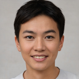 Joyful asian young-adult male with short  brown hair and brown eyes