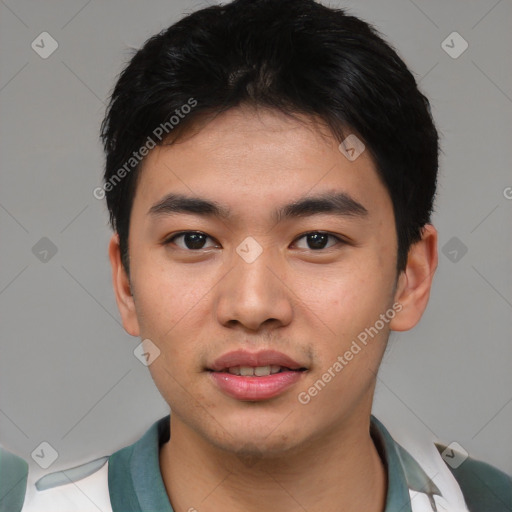 Joyful asian young-adult male with short  black hair and brown eyes