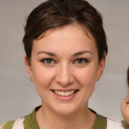 Joyful white young-adult female with medium  brown hair and brown eyes