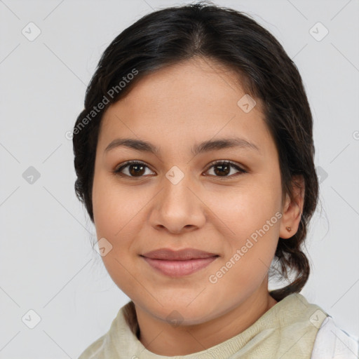 Joyful latino young-adult female with medium  brown hair and brown eyes