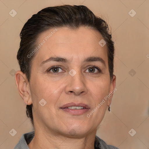 Joyful white adult female with short  brown hair and brown eyes