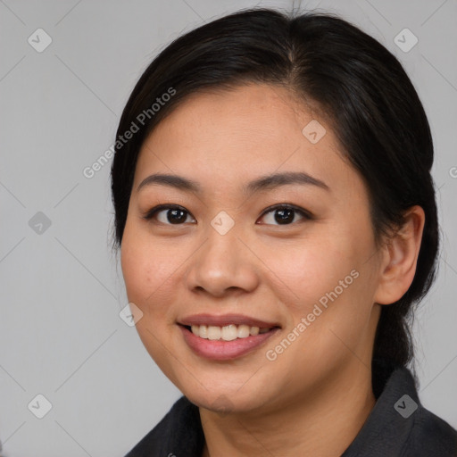 Joyful asian young-adult female with medium  black hair and brown eyes