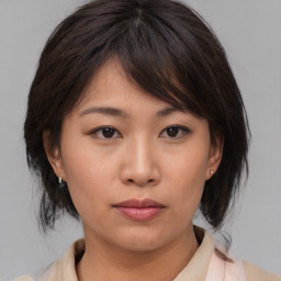 Neutral asian young-adult female with medium  brown hair and brown eyes