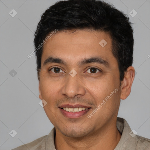 Joyful white young-adult male with short  black hair and brown eyes