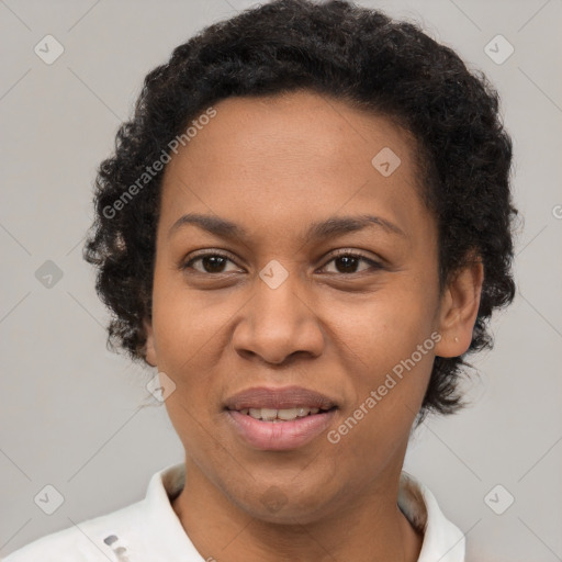 Joyful black adult female with short  brown hair and brown eyes