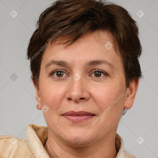 Joyful white adult female with short  brown hair and brown eyes