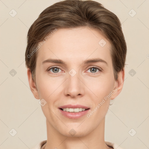 Joyful white young-adult female with short  brown hair and grey eyes